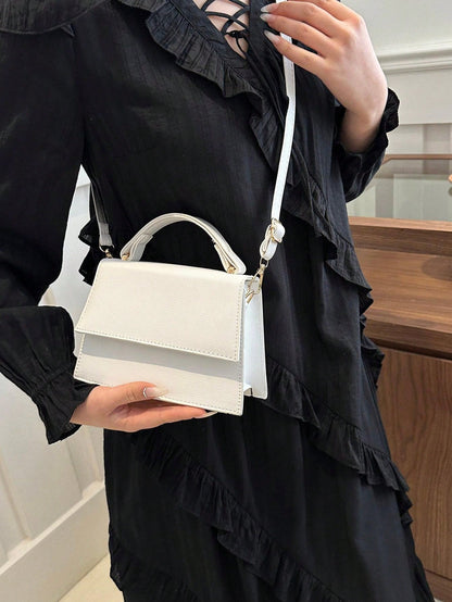 Mini crossbody taske i multifarvet udgave set fra siden
