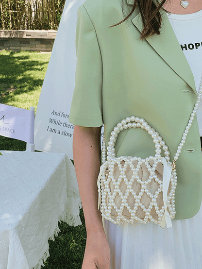 Elegant bucket bag med perlebesat overflade