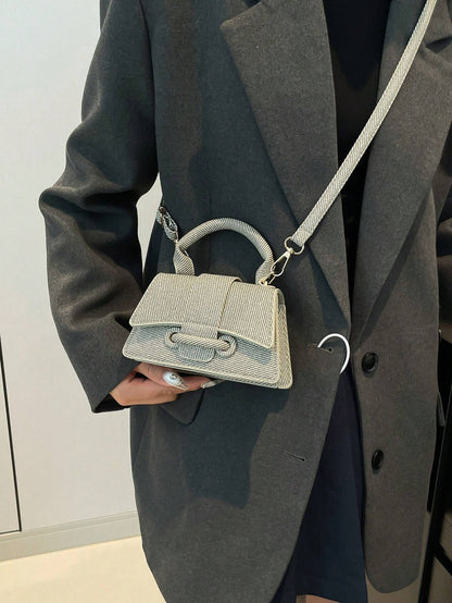 Mini håndtaske dame i sort – clutch og skulderrem