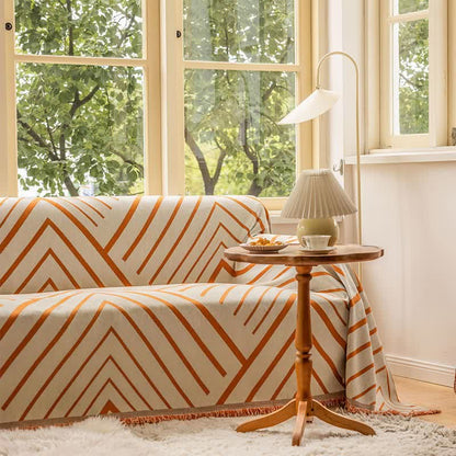 Sofabeskytter med argyle-mønster lagt over en sofa