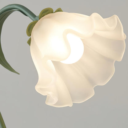 Dekorativ sengelampe med blomsterdesign i grønt akryl