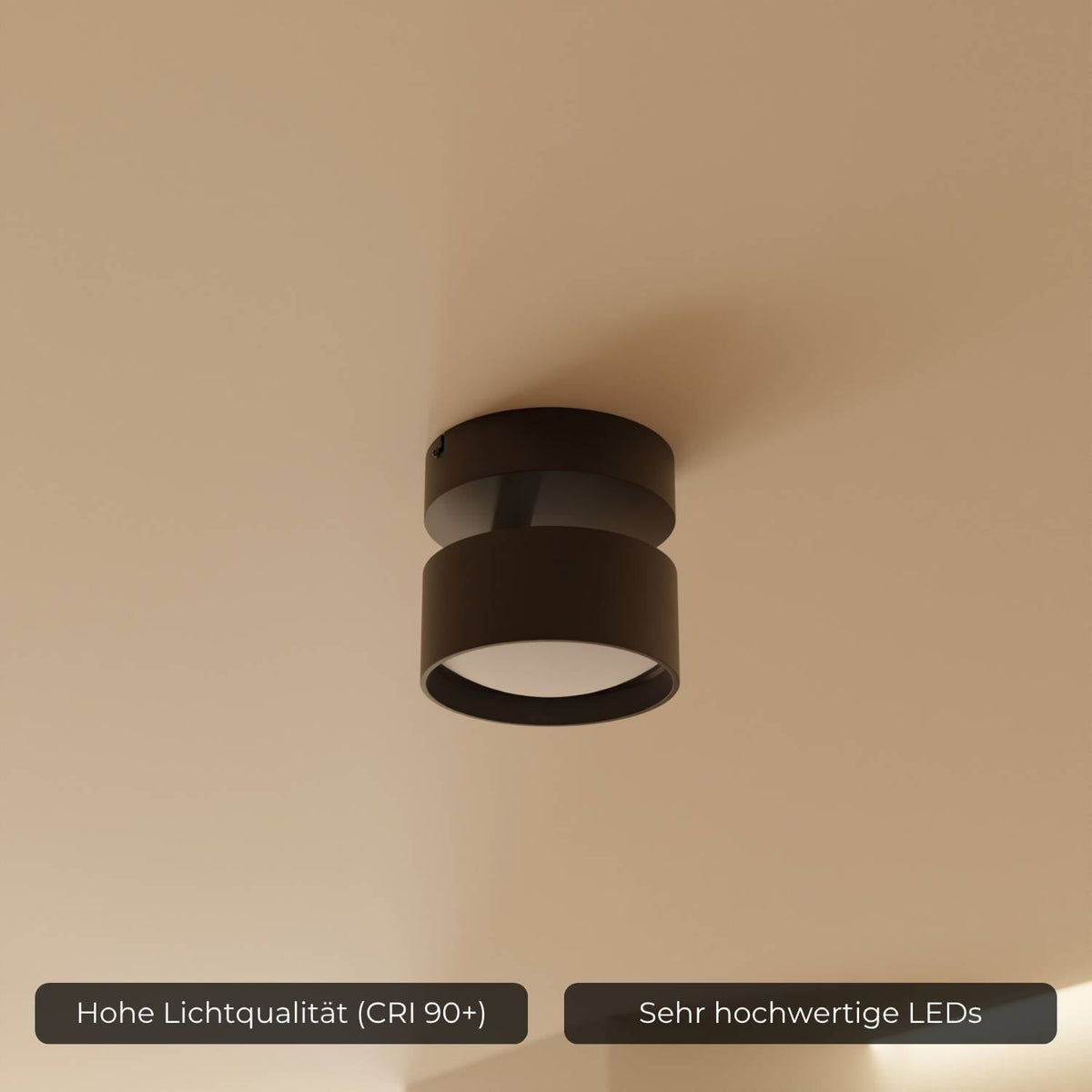 Nærbillede af cylinderformet sort loftlampe med LED-belysning