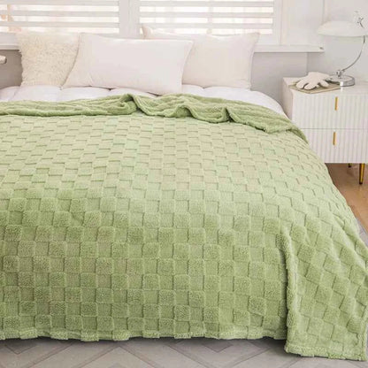 Dobbeltsidet jacquard tæppe foldet til visning af begge sider